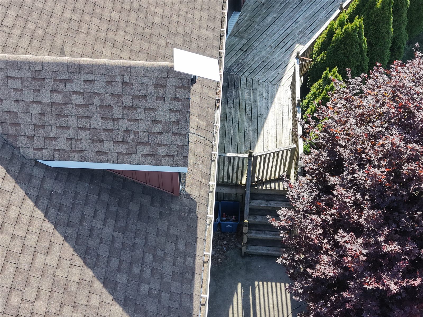 Aerial drone close-up of roof shingles and flashing during a roofing inspection in Ontario