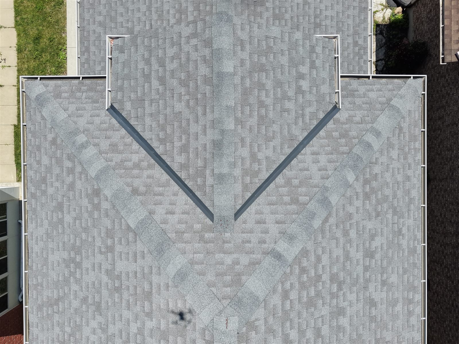 Drone roof overview photo for storm damage and wear assessment